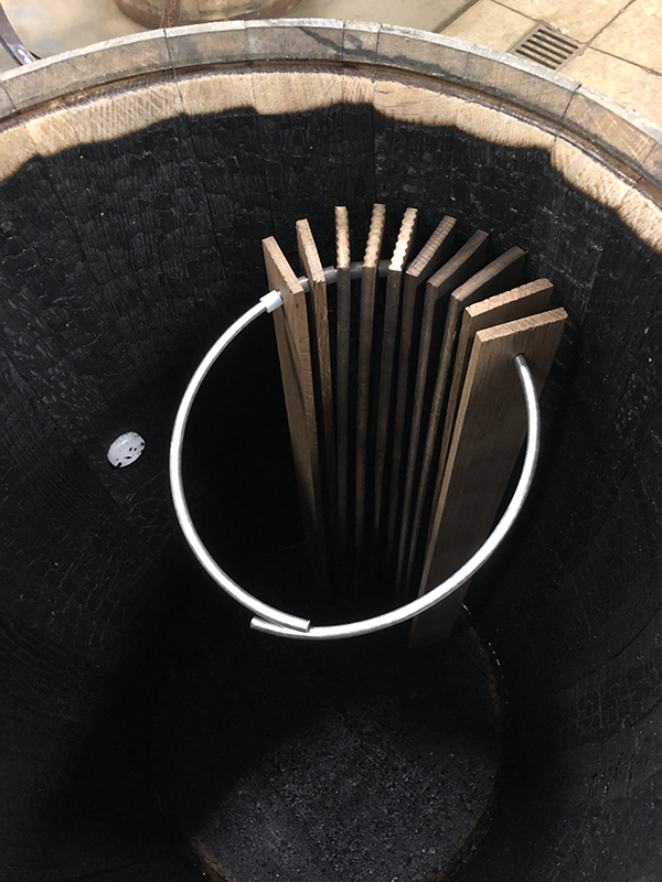 Whiskey aging staves in barrel