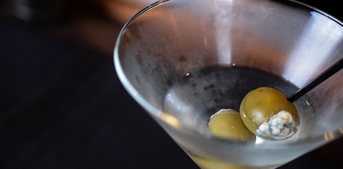 Martini cocktail with stuffed olives