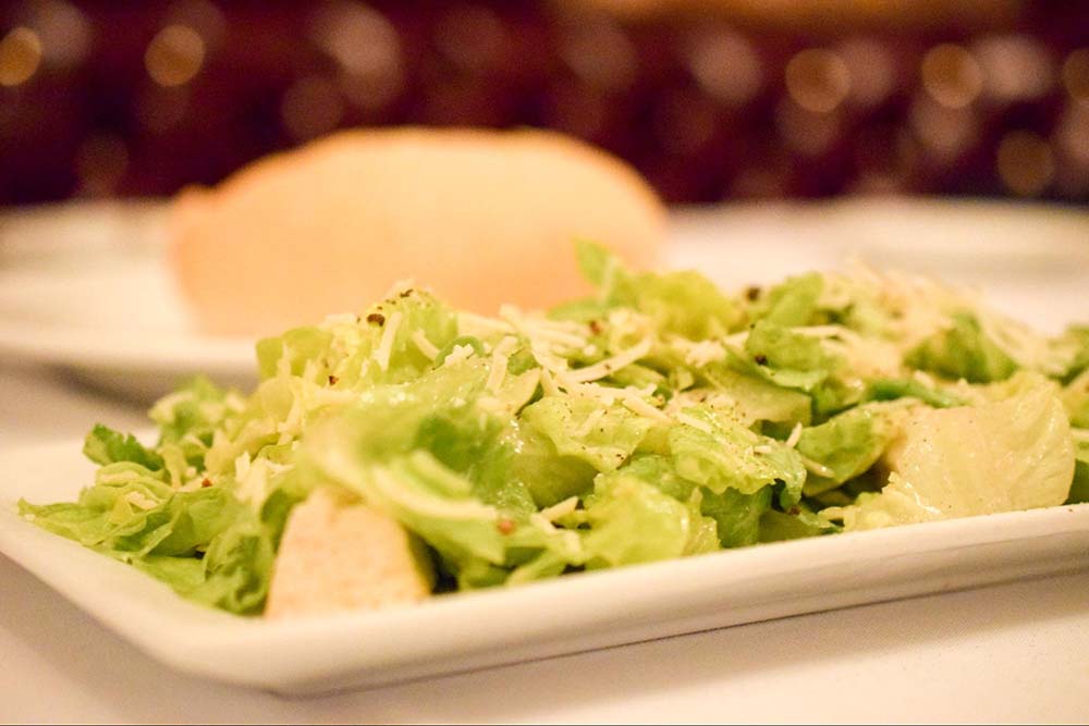 a Caesar salad on a plate