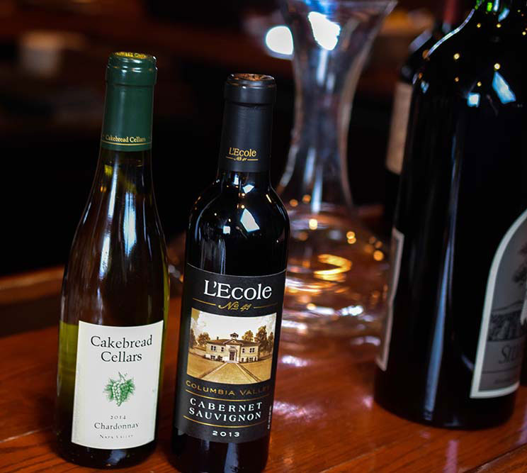 a bottle of red wine next to a bottle of white wine at Christner's Steakhouse