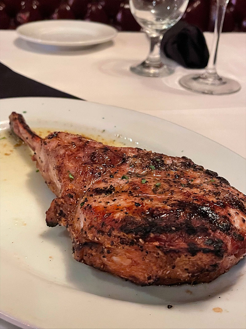 Christner’s tomahawk pork chop on a plate